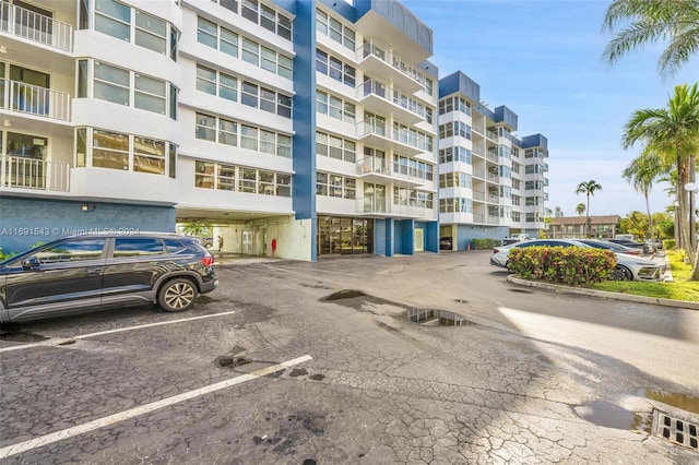 16570 NE 26th Ave Unit 2A, North Miami Beach, FL 33160 - view of apartment building / complex with uncovered parking