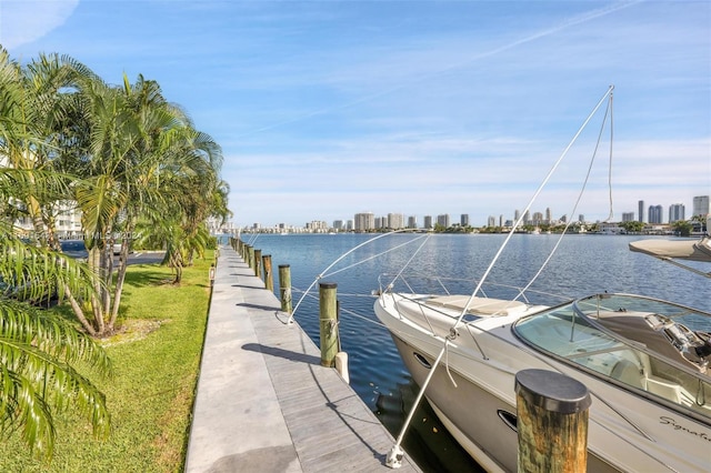 16570 NE 26th Ave Unit 2A, North Miami Beach, FL 33160 - dock with a water view, a skyline view, and a lawn