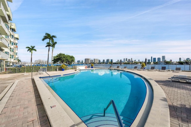 16570 NE 26th Ave Unit 2A, North Miami Beach, FL 33160 - community pool with a skyline view and a patio