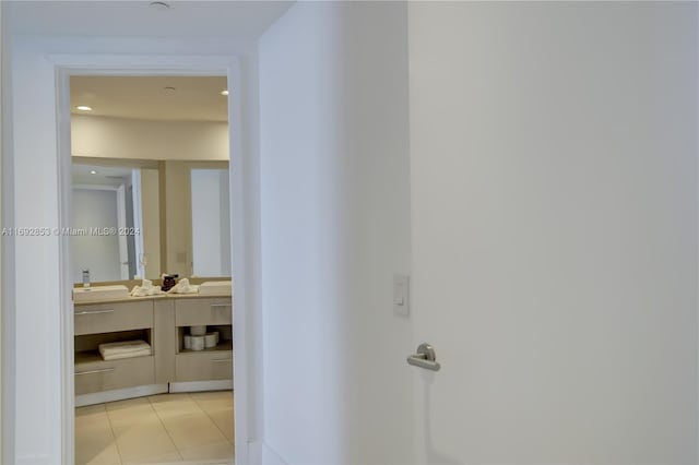 hallway featuring light tile patterned floors