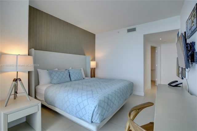 bedroom with light tile patterned floors