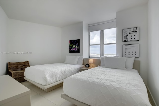 bedroom with light tile patterned floors