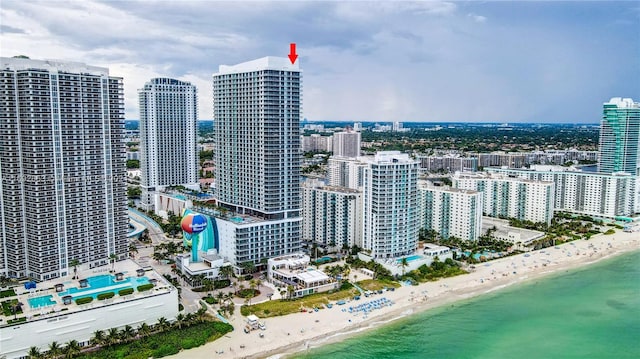 bird's eye view featuring a beach view and a water view