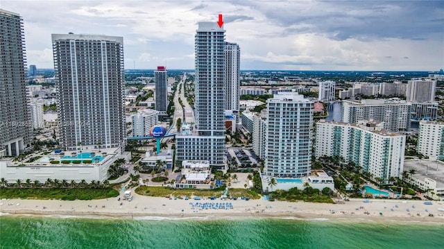 city view featuring a view of the beach and a water view