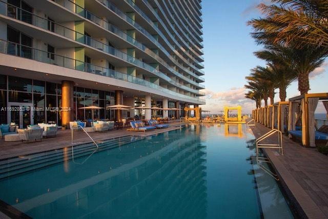 view of pool with a water view