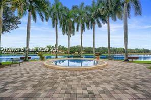 view of swimming pool with a water view