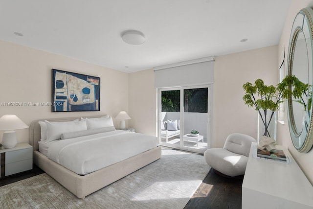 bedroom featuring access to outside and hardwood / wood-style flooring