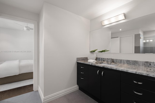 bathroom with tile patterned floors and vanity