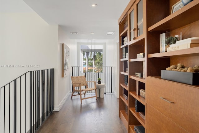 hallway with dark hardwood / wood-style floors