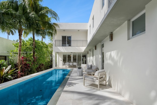 view of swimming pool with an outdoor hangout area and a patio area