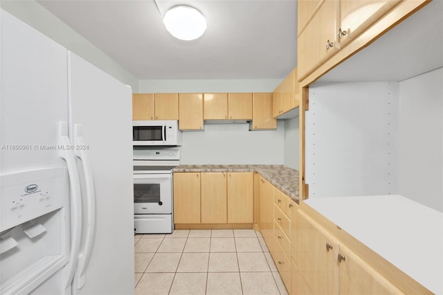 kitchen featuring light brown cabinets, light tile patterned floors, and white appliances