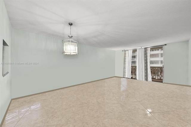 empty room with a textured ceiling