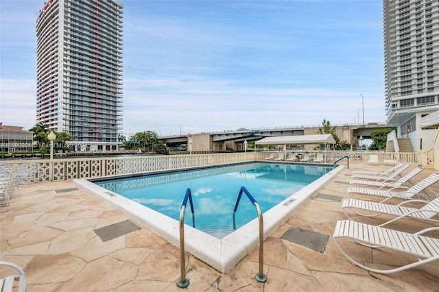 view of swimming pool featuring a patio