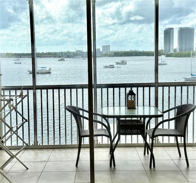 balcony featuring a water view