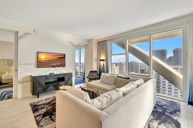 living room with a fireplace and hardwood / wood-style flooring