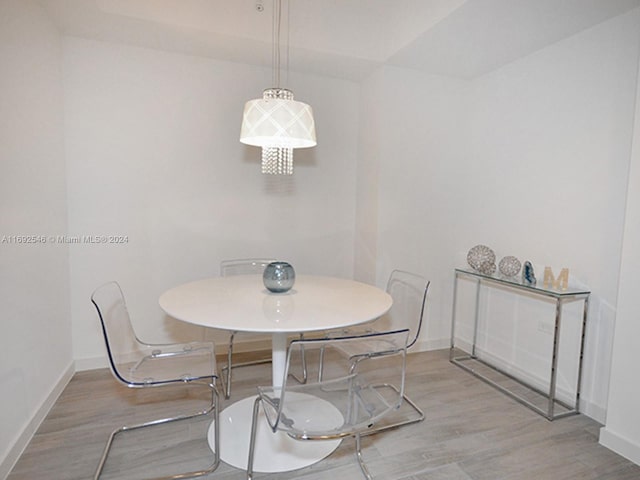 dining space featuring light hardwood / wood-style floors