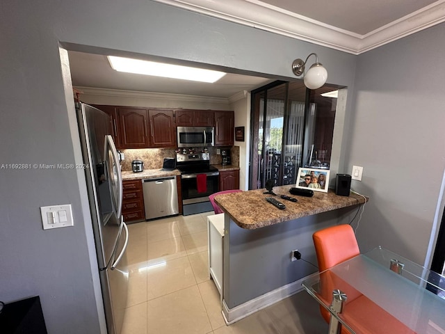 kitchen with kitchen peninsula, stainless steel appliances, light tile patterned floors, and crown molding