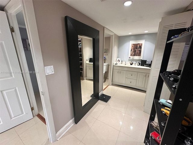 bathroom with vanity, tile patterned flooring, and toilet