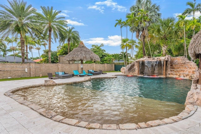 view of pool with a gazebo, pool water feature, and a patio area