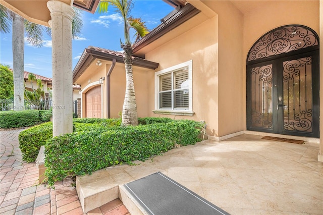 property entrance with a garage