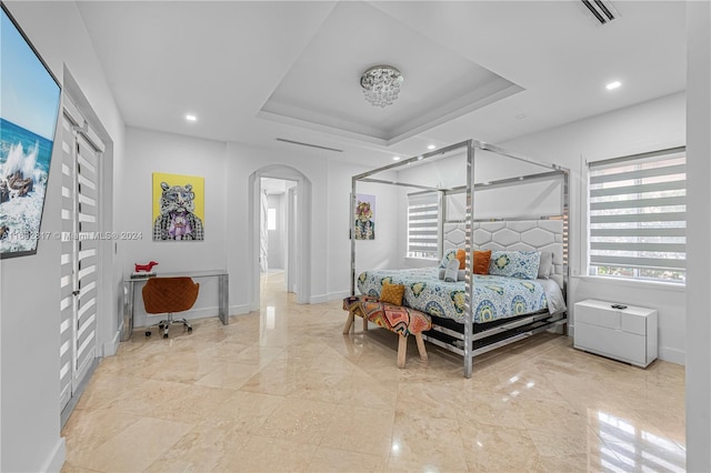 bedroom featuring a tray ceiling