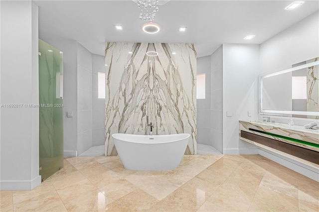 bathroom featuring shower with separate bathtub and vanity