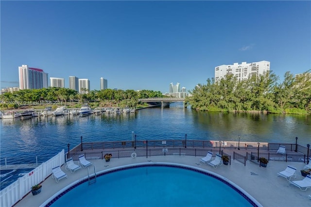 view of pool featuring a water view