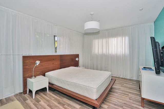 bedroom featuring light wood-type flooring