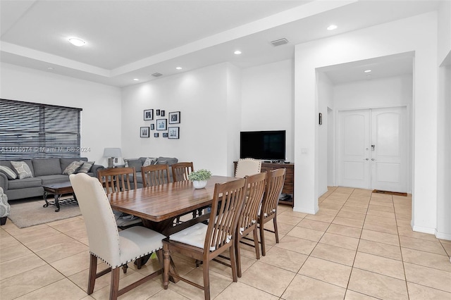 dining space featuring light tile patterned floors