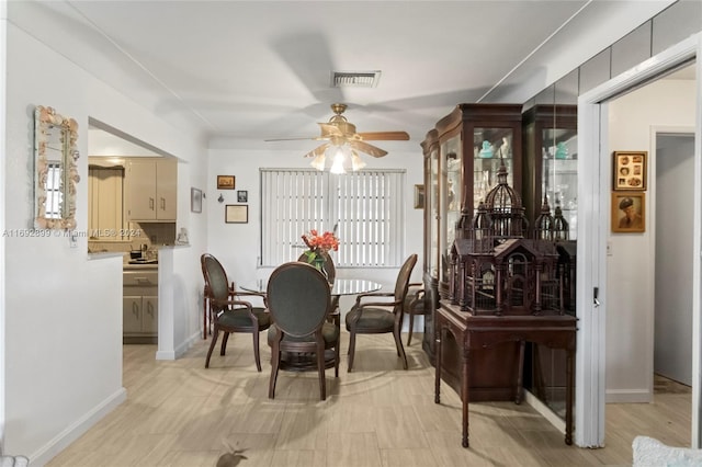 dining area with ceiling fan