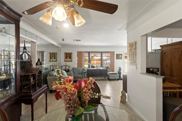 dining space featuring ceiling fan and a healthy amount of sunlight