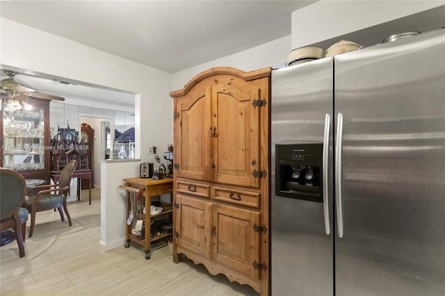 kitchen with stainless steel fridge and ceiling fan