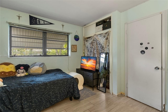 bedroom with light hardwood / wood-style flooring