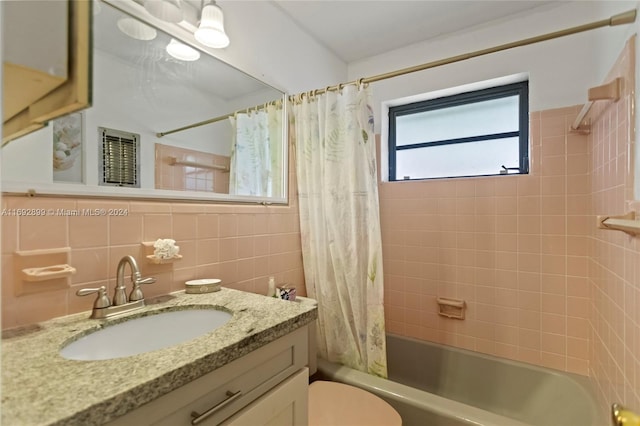 full bathroom featuring decorative backsplash, vanity, shower / tub combo with curtain, tile walls, and toilet