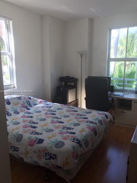 bedroom featuring wood-type flooring