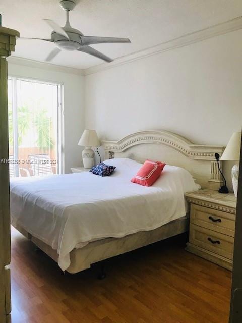 bedroom with access to outside, dark hardwood / wood-style flooring, ceiling fan, and crown molding