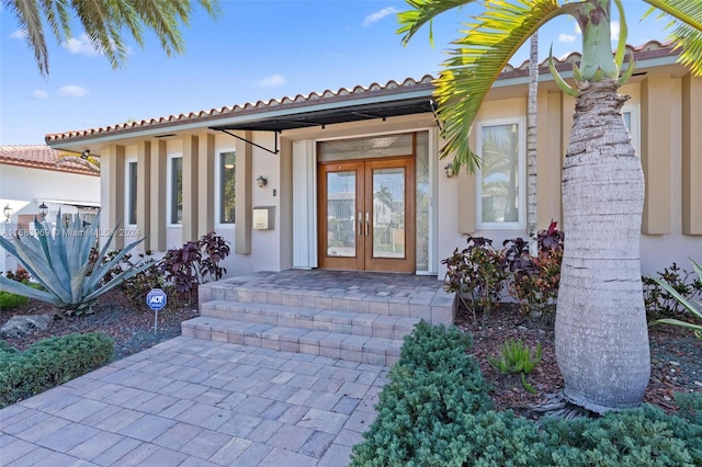 view of exterior entry featuring french doors