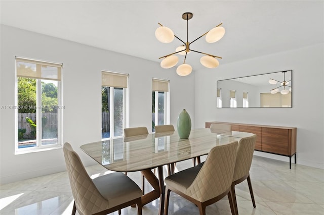 dining space with a notable chandelier