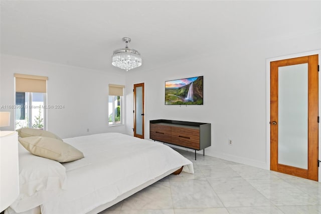 bedroom with an inviting chandelier