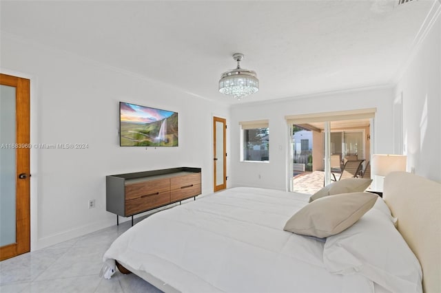 bedroom featuring an inviting chandelier, light tile patterned floors, ornamental molding, and access to exterior