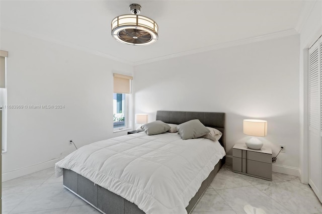 bedroom featuring a closet and ornamental molding