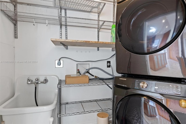 laundry room featuring stacked washing maching and dryer