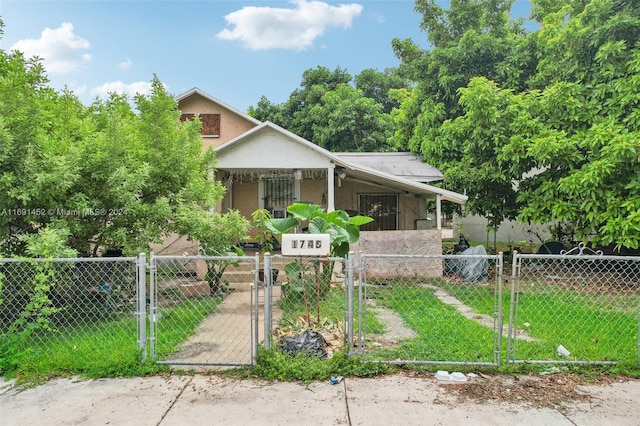 view of front of house with a porch and a front yard