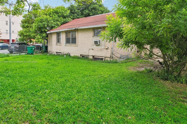 view of yard featuring a wall unit AC