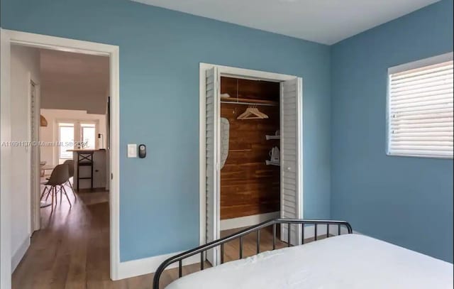 bedroom featuring hardwood / wood-style flooring and a closet