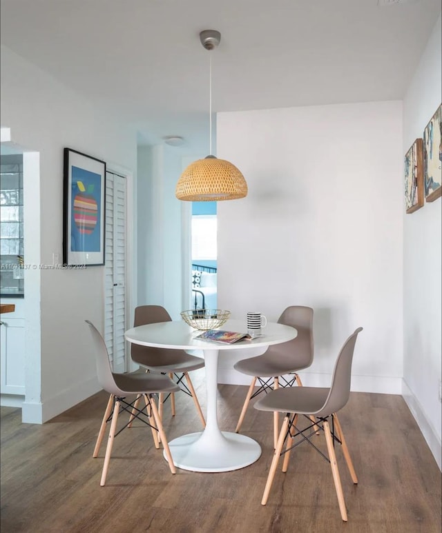 dining area featuring dark hardwood / wood-style flooring