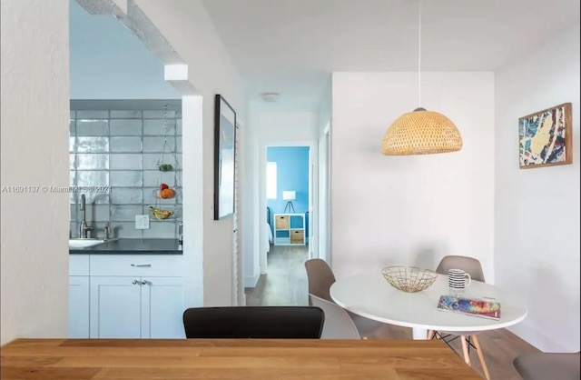 dining area with wood-type flooring