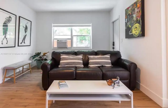 living room featuring light hardwood / wood-style floors and cooling unit