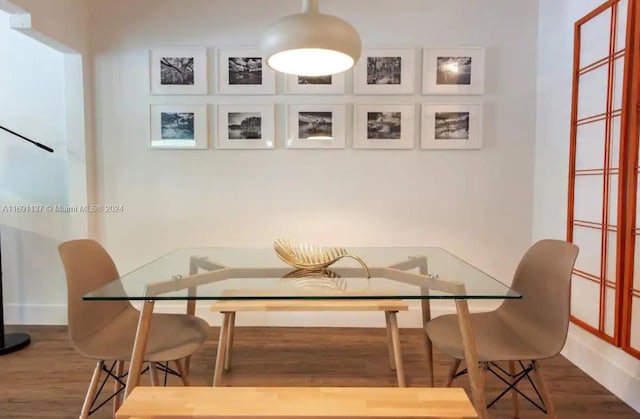 dining room with hardwood / wood-style floors