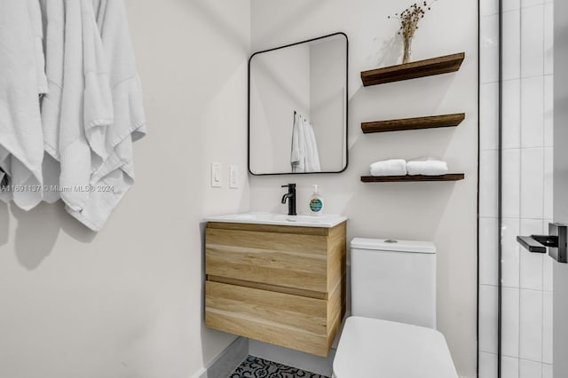 bathroom with toilet and vanity